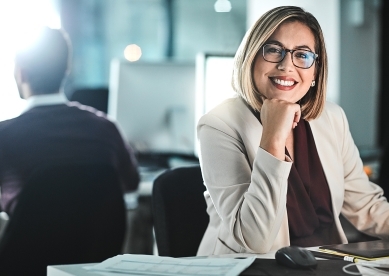 Smiling woman at desk